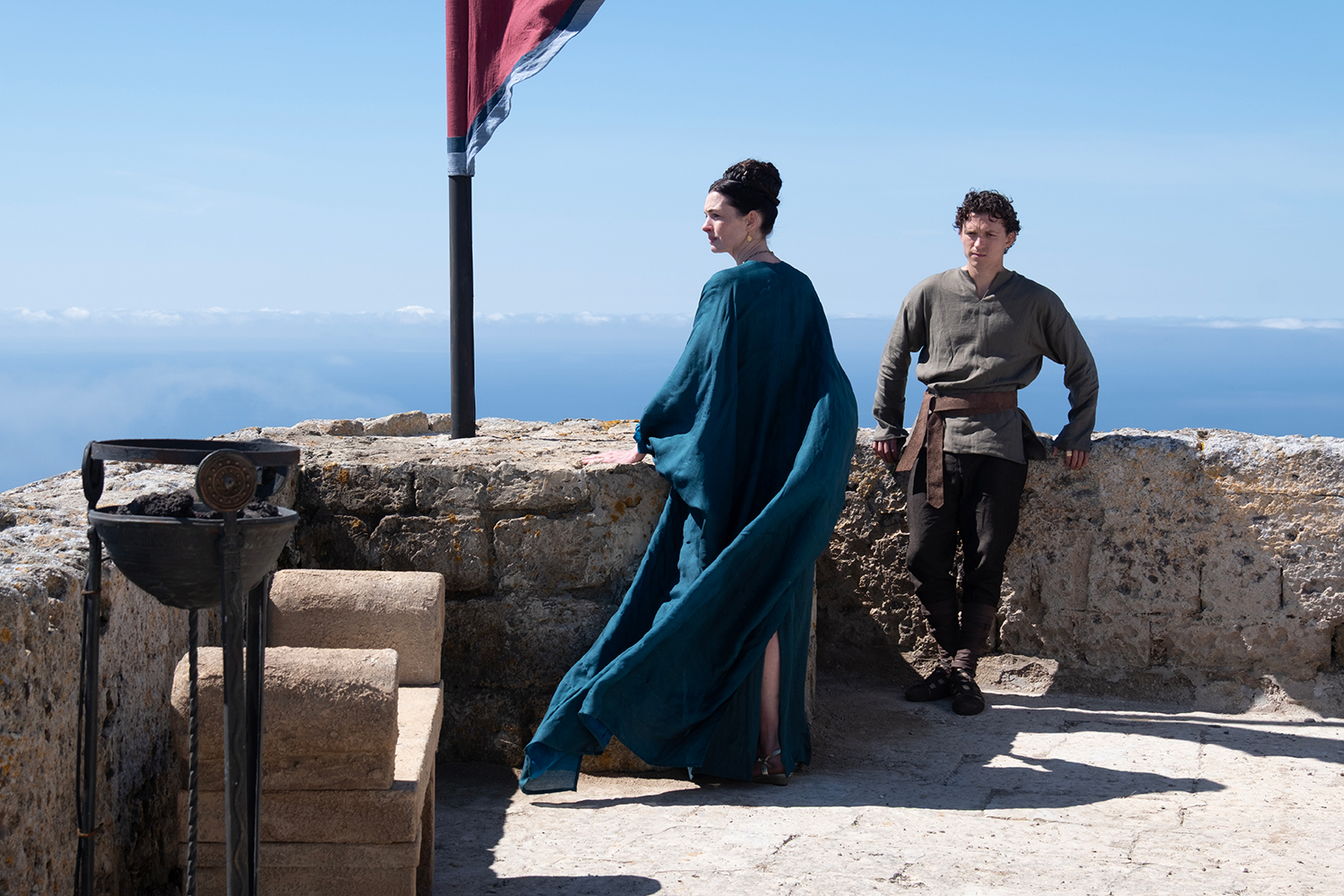 Anne Hathaway as Penelope and Tom Holland as Telemachus in a scene from 