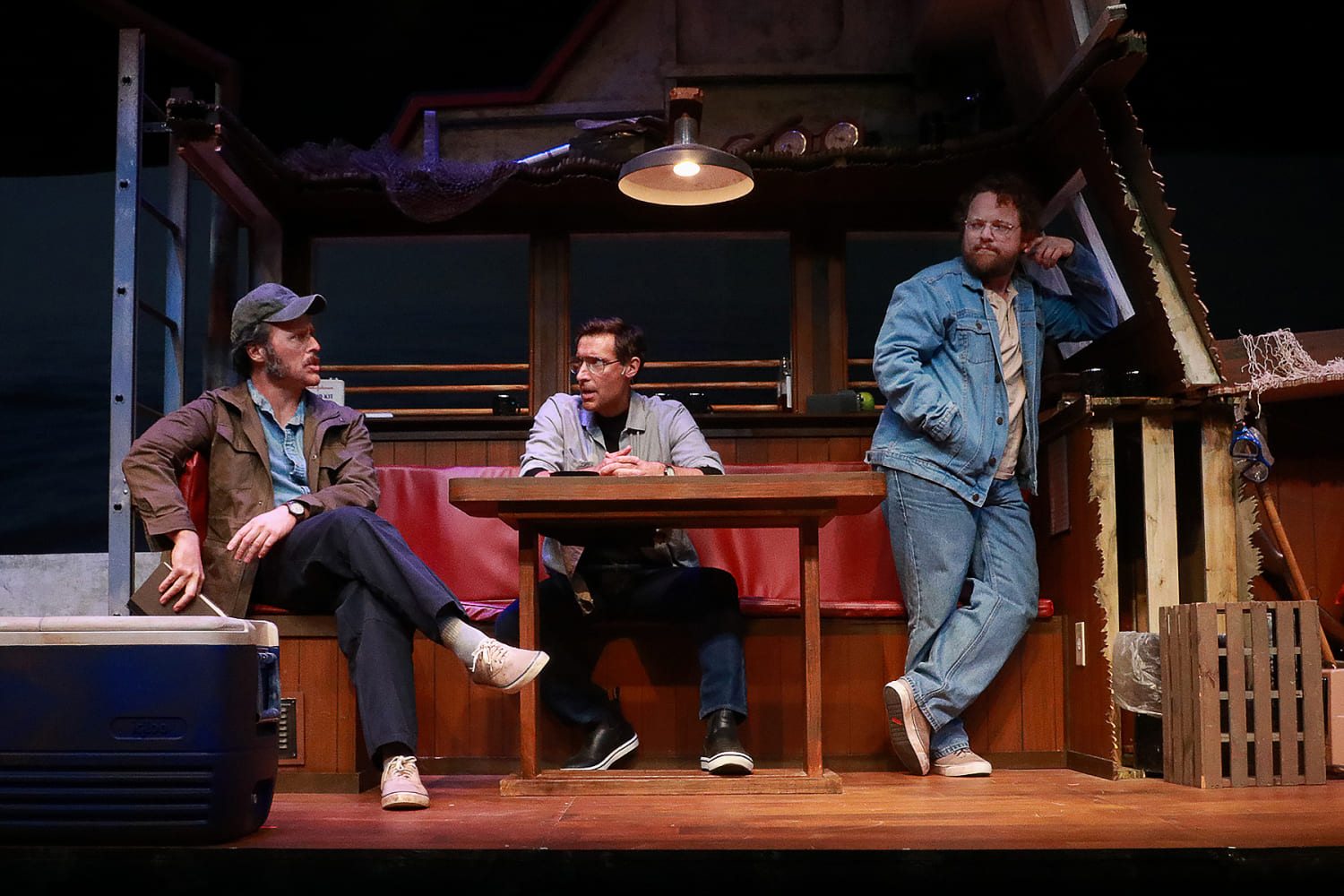 Iain Batchelor as Robert Shaw, Adam Poole as Roy Scheider, and Wesley Slade as Richard Dreyfuss. in Actors' Playhouse's production of 