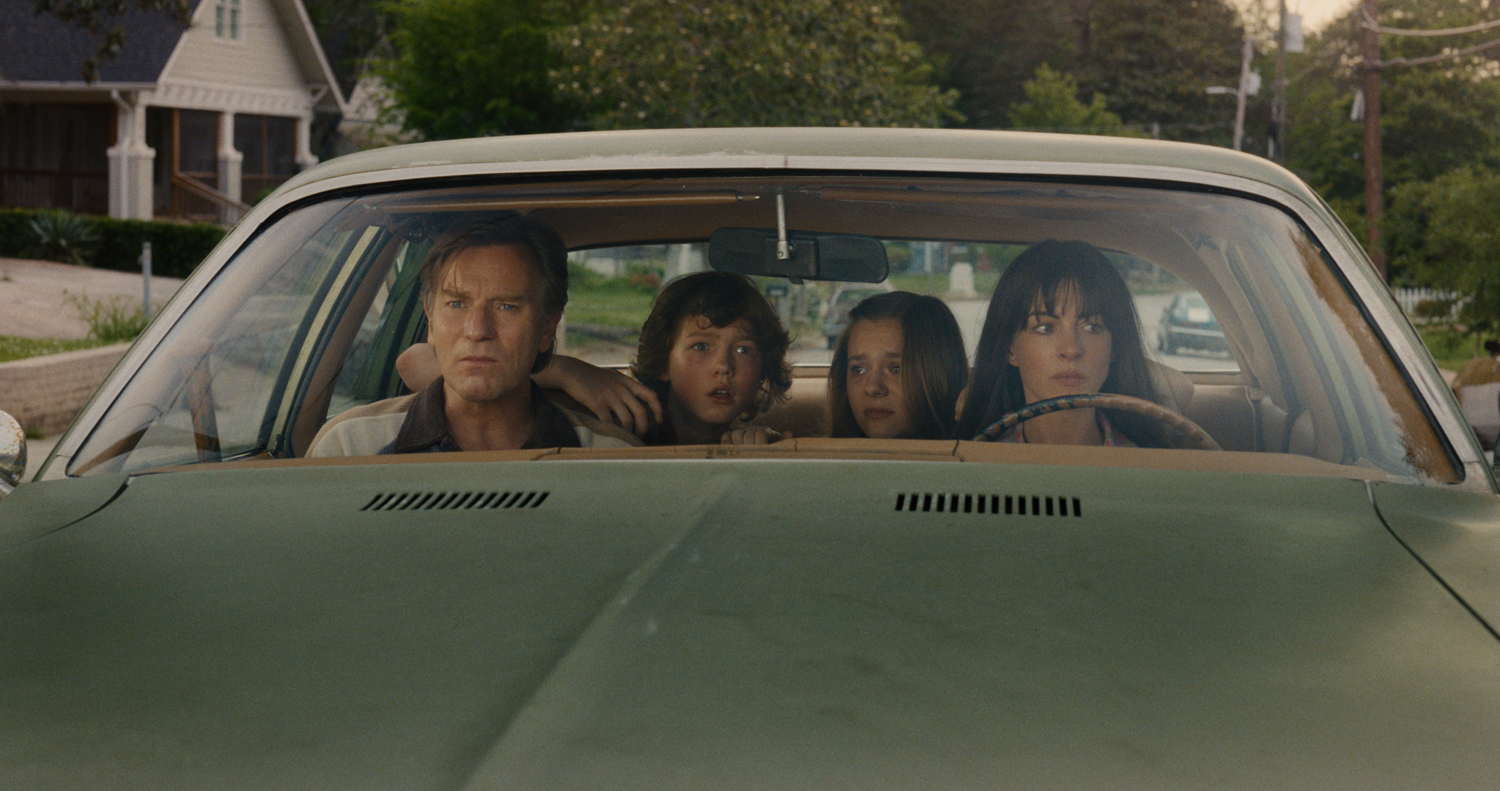 Ewan McGregor as Greg Platt, Christian Convery as Brian Platt, Maisy Stella as Audrey Platt and  Anne Hathaway as Denise Platt in a scene from 