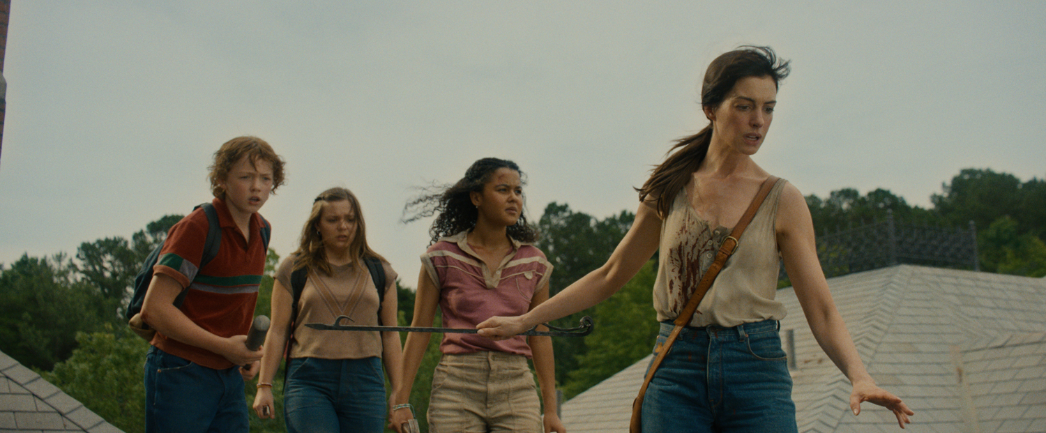 Christian Convery as Brian Platt, Maisy Stella as Audrey Platt, Jordan Alexa Davis as Jeannette Christiansen and  Anne Hathaway as Denise Platt in a scene from 
