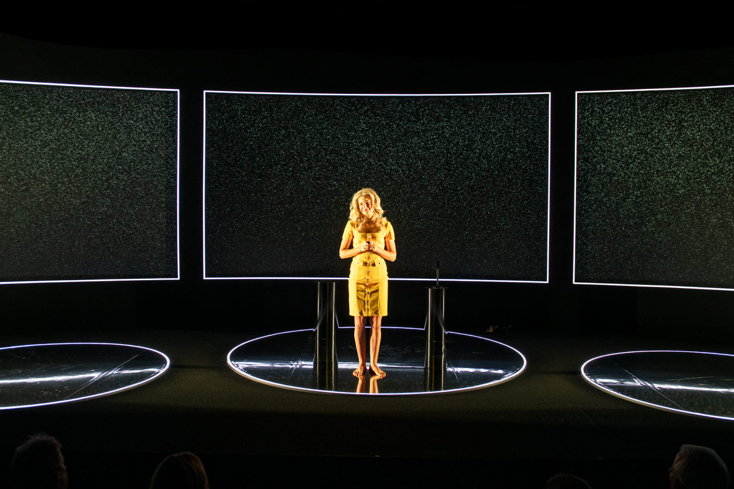 Frank J. Oliva's set features three glossy black circles. (Photo by Magnus Stark, courtesy of GableStage)