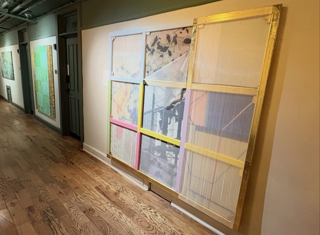 Juan Raúl Hoyos turns the stretcher bars behind a canvas inside out in the show 