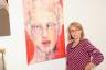 . . . and posing next to her donated mixed media on canvas piece titled Venus/Red