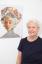 Judy Clark next to Deming Harriman’s Flower Portrait