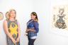 Tatiana Knotts with artist RoJo, next to Deming Harriman’s piece Butterfly Snake Goddess