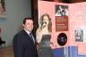 Joe Avila poses next to Gloria Estefan display