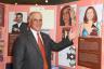 HistoryMiami President/CEO Ramiro A. Ortiz gladly poses next to Albita display