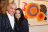 Mark Haulohl and Ana Paula Watson next to Alexander Calder's 1969 Macarons multicolores