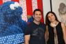 Michael Giragosian and Nune Asatryan next to David Hollier's artwork