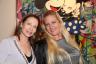 Ann Hernandez and Meredith Arguelles next to Mr. Brainwash's "Mickey & Minnie"