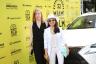 "Posthumous" Producer Bernadette Burgi and Director Lulu Wang pose next to 32nd MIFF sponsor Lexus