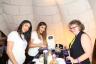 Alejandra Gomez and Ana Pavarez serving Patron's "XO Frozen Hot Chocolate" to "The Record Man" Producer Debra Egber