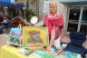 Artist Tania displays her acrylic & oil on canvas artwork.
