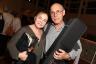 Julian Romano with Mayra Romano who won Kenny G's soprano saxophone replica in raffle.