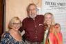 Charlotte Libov poses with Al Alschuler and Jennifer Blackmore and . . .