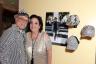 George Neary, here with Jewish Museum of Florida-FIU Executive Director Susan Berg Gladstone, exhibits is hat collection