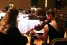 Violin players of The Henry Mancini Institute Orchestra