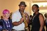 Flossie Williams with Saxophonist Miguel Newberry and his wife, Colliysha. Newberry played his saxophone at the event.