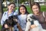 Betty Aguilera, Emily Nu–ez and Rebecca Scheuermann with their pets Pearla and Champion