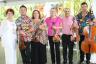 Jacqueline Lorber, CEO/President of the South Florida Symphony with musicians from the orchestra who performed at the brunch.