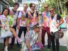 Fashion designer Daniel Chimowitz with several South Florida Symphony 			musicians wearing his designs