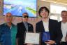 Harvey Burstein, David New, and Miami Beach Mayor Steven Meiner with Anier 			Gonzalez, the first recipient of the Harvey J. Burstein Legacy Scholarship.